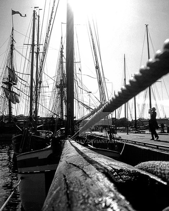 On a larger scale a  ship dances still between the... more monochrome photography at http://bnw.alahay.org